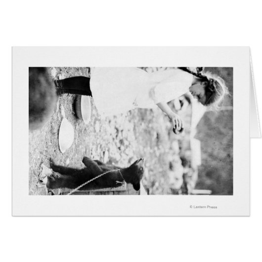 Girl Feeding Bear Cub in Seward (Front Horizontal)