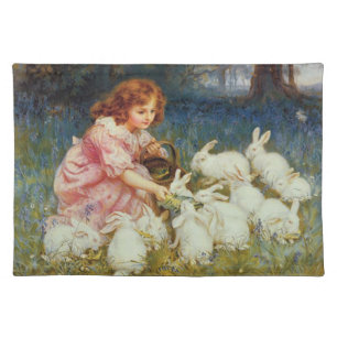 Girl feeding rabbites placemat