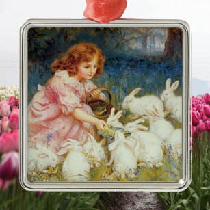 Girl feeding rabbits metal ornament