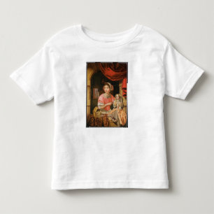 Girl holding a doll in an interior toddler t-shirt