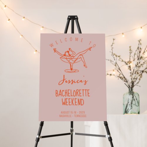 Girl in cocktail bachelorette welcome sign