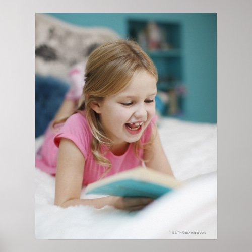 Girl laying in bed reading book poster