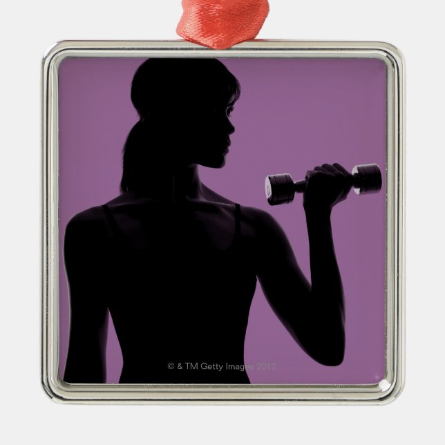 girl lifting dumbbell on purple background metal ornament (Front)