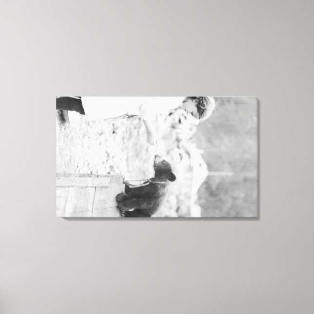 Girl Playing with Bear Cub in Seward 2 Canvas Print (Front)