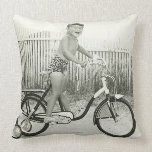 Girl Riding Bicycle Throw Pillow