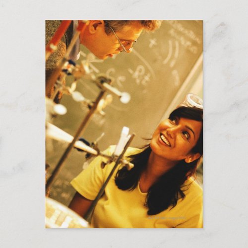 Girl smiling at teacher in chemistry lab postcard