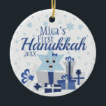 Girl | Star of David in Gifts First Hanukkah Photo Ceramic Ornament<br><div class="desc">The perfect way to commemorate a new bundle of joy's first holiday! An adorable design of a smiling Star of David proudly wearing a blue bow, bursting through gifts. This design features a simplistic and traditional color scheme in silvers and blues. Don't forget to change the custom photo and text...</div>