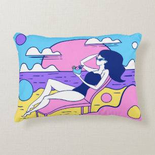 girl sunbathes on the beach with a cocktail in han accent pillow
