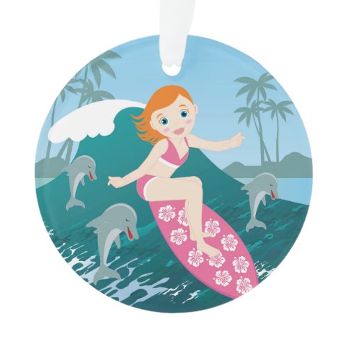 Girl surfs big wave with dolphins ornament