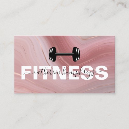 Girly Fitness Trainer Social Media Business Card - Modern personal trainer business cards featuring a pink & gold marble background, gym weights, your name, title, contact details, and social media icons. The icons can be removed by clicking on personalize and then tap to customize further.