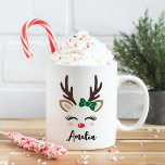 Girly Reindeer Face Personalized Name Christmas Coffee Mug<br><div class="desc">Cute Christmas coffee or hot cocoa mug features an illustration of a sweet reindeer girl face with pretty eyelashes, rosy blush cheeks, a green bow on her antlers, and a shiny red nose. Personalize this festive hot chocolate mug with a first name or other custom text. Makes a fun holiday...</div>