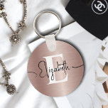 Girly Rose Gold Brushed Metal Script Name Monogram Keychain<br><div class="desc">Elevate your style with our Girly Rose Gold Brushed Metal Script Name Monogram Keychain! Crafted from exquisite rose gold brushed metal, this keychain exudes elegance and sophistication. Personalize it with your monogram in bold white text and your script name in elegant black typography, creating a stunning accessory that reflects your...</div>