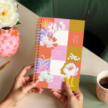 Girly Watercolor Peony Florals Retro Checkered Planner<br><div class="desc">Add a touch of elegance and playfulness to your daily planning with this unique, handprinted planner. Featuring our delicate handpainted watercolor white peony florals paired with bold, abstract floral shapes, this planner showcases a vibrant retro checkered pattern in stunning shades of orange, pink, purple, and gold. It’s the perfect blend...</div>