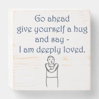 Give yourself a hug and say I am deeply loved sign