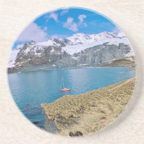 Glaciers and sailing yacht in background sandstone coaster