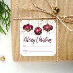 Glam Burgundy Gold Ornaments Merry Christmas Square Sticker<br><div class="desc">This glam holiday gift sticker features a trio of burgundy and gold faux foil and glitter ornaments, with a sprinkling of gold faux glitter in the background. The words "Merry Christmas" appear in elegant burgundy faux foil calligraphy script, along with "TO" and "FROM" in burgundy sans serif font on a...</div>