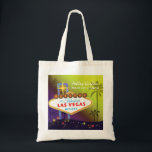 Glam Las Vegas Wedding Maid of Honor Gift Tote Bag<br><div class="desc">Big and glamorous Las Vegas strip sign tall palm trees and colorful stars yellow & purple shades background illustrated on custom Maid of Honor Gift Bags. Personalize the artsy and unique tote bags for your maid of honor and/or bridesmaids to thank them! ((You can find the matching wedding essentials &...</div>