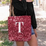 Glam Red Faux Glitter Bokeh Sparkles Monogram Tote Bag<br><div class="desc">A modern bold single letter monogram in white with a black drop shadow. The font size, color and style are customizable. The background is a faux red glitter with sparkly spots or bokeh. Move or delete the tiny faux sparkle graphic images. Girly chic gift for a bridesmaid or other member...</div>