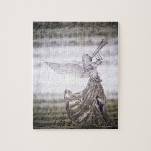 Glass angel playing trumpet and image of sheet jigsaw puzzle