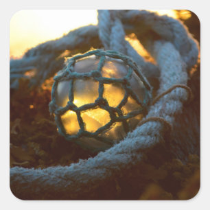 Glass float glows at sunset, Alaska Square Sticker