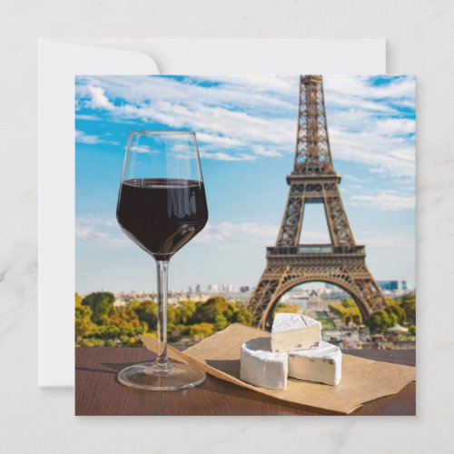 Glass of wine with brie cheese on Eiffel tower