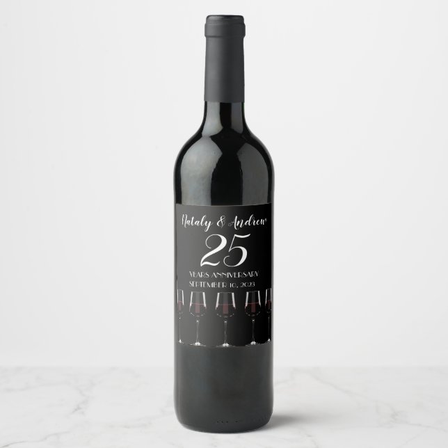 Glasses of red wine on black label (Front)