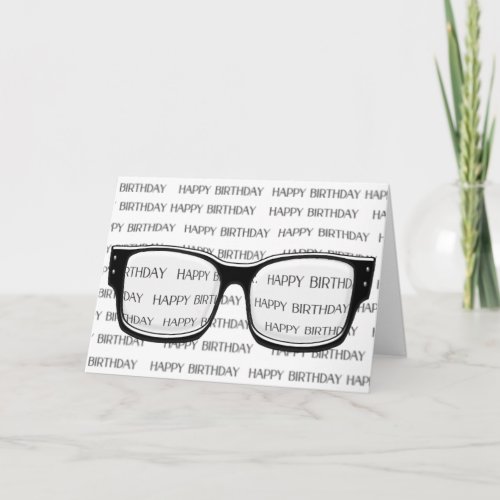 glasses on blurred card