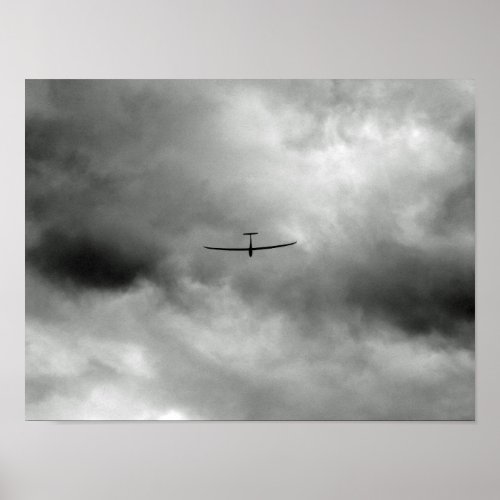 Glider flying in grey sky poster