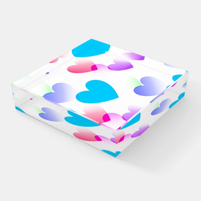 Gliding Hearts on Clear Glass Paperweight Display (Angled)