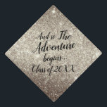 Glitter Gold Adventure Begins  Custom Class Year Graduation Cap Topper<br><div class="desc">Celebrate the graduate with this elegant and beautiful grad cap topper features the quote "And so the adventure begins" in modern handwritten lettering over a super feminine and glam glitter gold background.
Use the template to personalize the cap!</div>