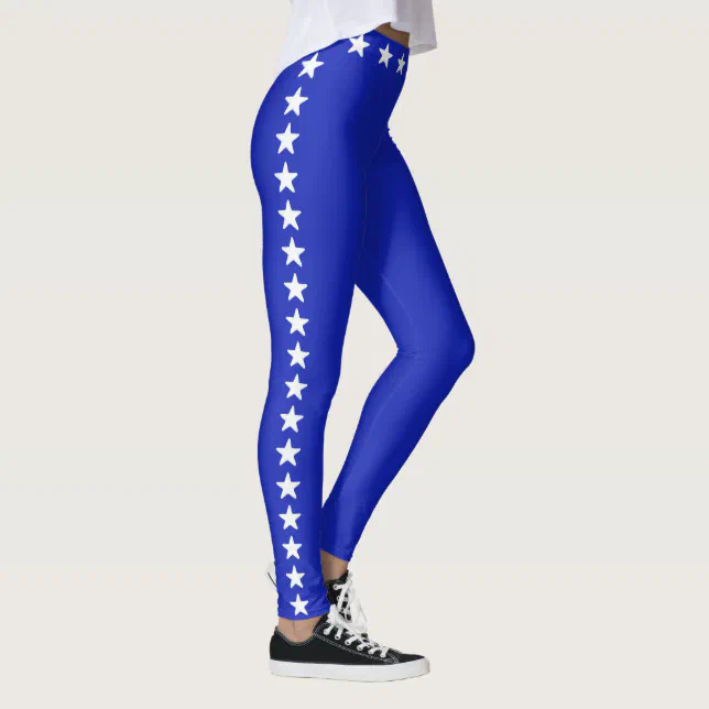 Glittering white stars on royal blue leggings | Zazzle