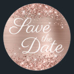 Glittery Rose Gold Elegant Save the Date Classic Round Sticker<br><div class="desc">Elegant calligraphy save the date envelop seals for your modern wedding. Girly faux sparkly rose gold glitter on the top and bottom edge with extra sparkle over a faux pink blush rose gold brushed metal style ombre foil. Customize the white color or font style of this modern elegant text style....</div>