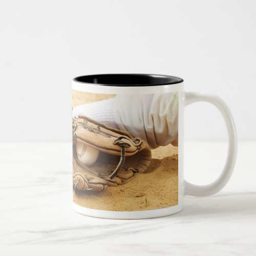 Glove of baseball player tagging runner out Two_Tone coffee mug