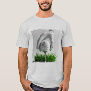 Gloved Hand Placing Golf Ball on Tee with Grass