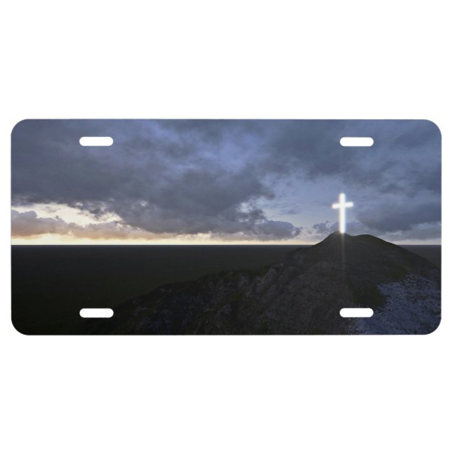 Glowing cross symbol against sky license plate (Front)