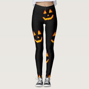 Glowing jack-o-lattern face on black halloween leggings