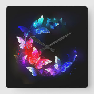 Glowing Neon Night Butterflies on Black background Square Wall Clock