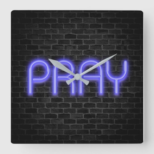 glowing neon PRAY sign on brick Square Wall Clock
