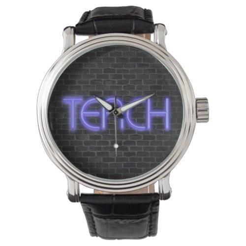 glowing neon TEACH text on brick Watch