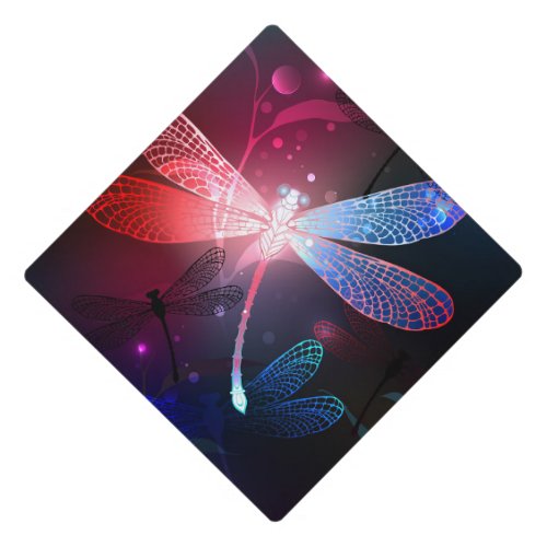 Glowing red dragonfly graduation cap topper