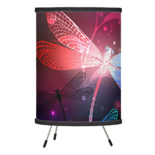 Glowing red dragonfly tripod lamp