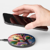 Glowing sunrise background with winged creature wireless charger (Hand)