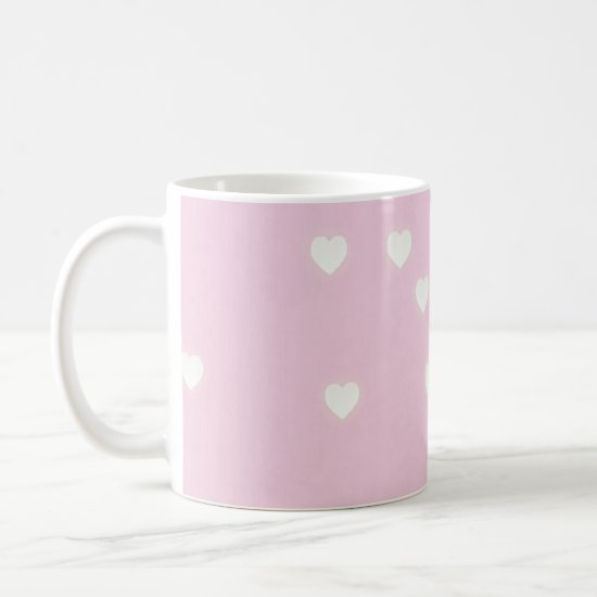 Glowing white hearts on pink coffee mug