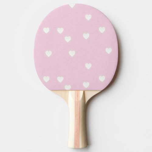 Glowing white hearts on pink ping pong paddle