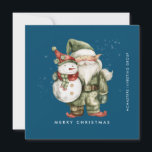 Gnome and Snowman Merry Christmas Businness Flat Holiday Card<br><div class="desc">A gnome dressed in red stands beside a snowman in a green elf stocking hat and red scarf. They are surrounded by a dusting of white snow that pops on the dark blue background. The minimalist aesthetic is created with a simple Merry Christmas below and the business name running perpendicular...</div>