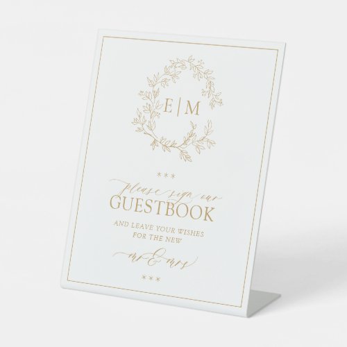 Go;d Leafy Crest Monogram Wedding Guestbook Pedestal Sign - We're loving this trendy, modern gold wedding guestbook pedestal sign! Simple, elegant, and oh-so-pretty, it features a hand drawn leafy wreath encircling a modern wedding monogram. It is personalized in elegant typography, and accented with hand-lettered calligraphy. Finally, it is trimmed in a delicate frame. Veiw suite here: https://www.zazzle.com/collections/gold_leafy_crest_monogram_wedding-119668631605460589 Contact designer for matching products to complete the suite, OR for color variations of this design. Thank you sooo much for supporting our small business, we really appreciate it! 
We are so happy you love this design as much as we do, and would love to invite
you to be part of our new private Facebook group Wedding Planning Tips for Busy Brides. 
Join to receive the latest on sales, new releases and more! 
https://www.facebook.com/groups/622298402544171  
Copyright Anastasia Surridge for Elegant Invites, all rights reserved.