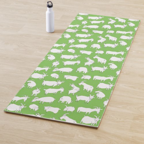 Goats playing _ green yoga mat