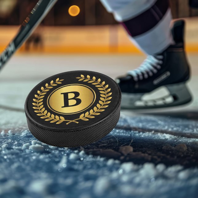 Gold and Black Monogram with Laurel Wreath Hockey Puck (Personalize with your monogram.)