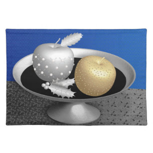 Gold and silver apples on a silver pedestal placemat