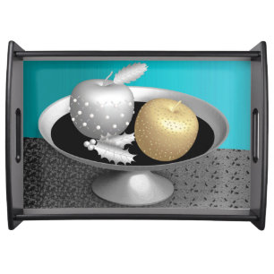 Gold and silver apples on a silver pedestal serving tray